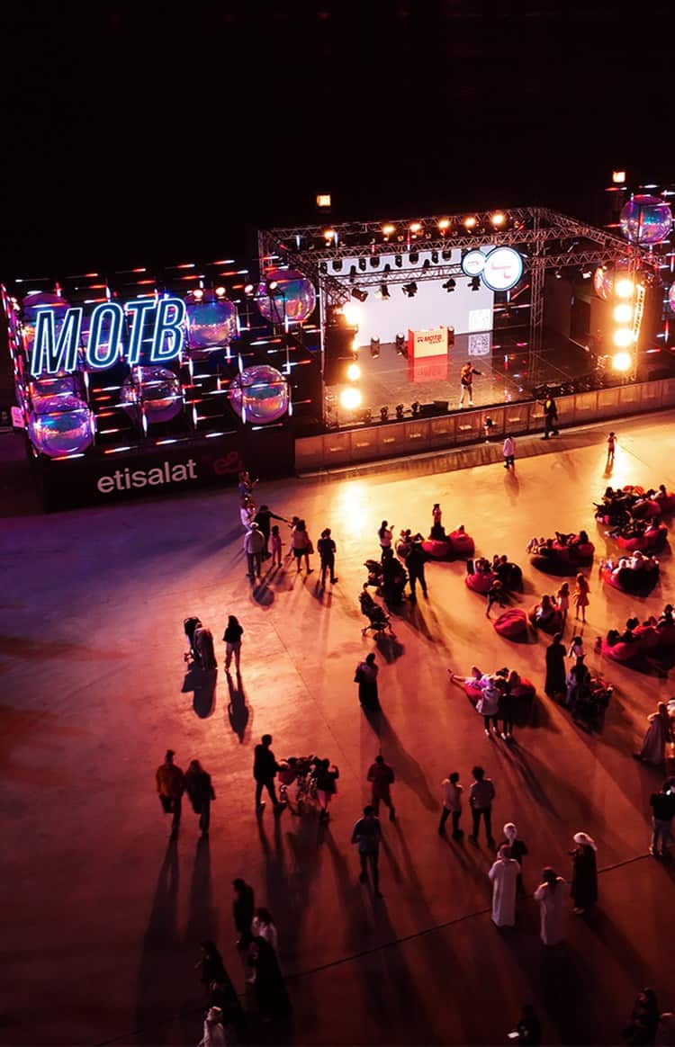 Aerial view of an outdoor event with a live entertainment stage